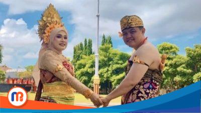Kabag Hukum Sekretariat Daerah Kabupaten Sumenep, Hizbul Wathan, bersama sang istri yang tampil anggun mengenakan busana adat Bali